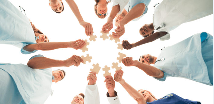 ACOs team of doctors with puzzle pieces.png