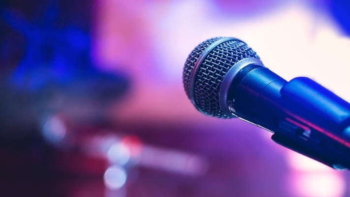 Microphone on purple background