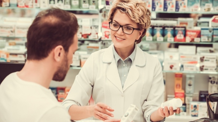 pharmacist suggesting drug to a client