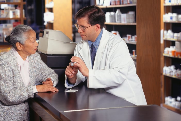 Pharmacist and older woman discussing medication.jpg